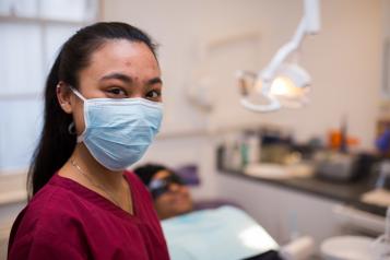 Dental assistant and patient