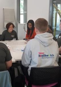 young healthwatch and northamptonshire young carers around a table at a meeting 